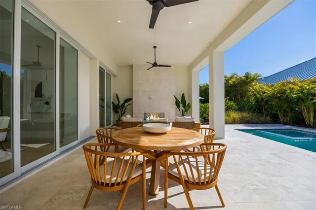 a dining room with furniture and wooden floor