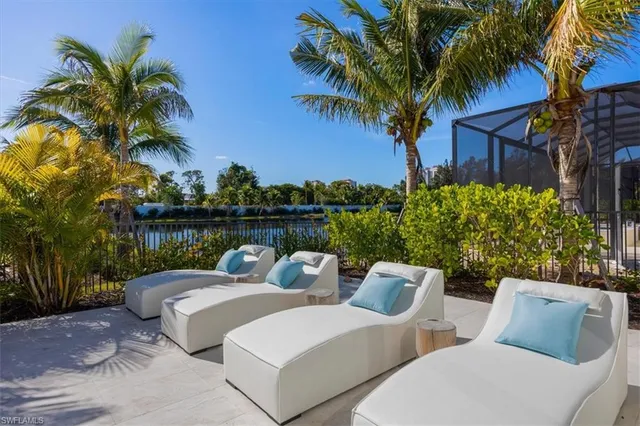 a couple of potted plants sitting in front of a house