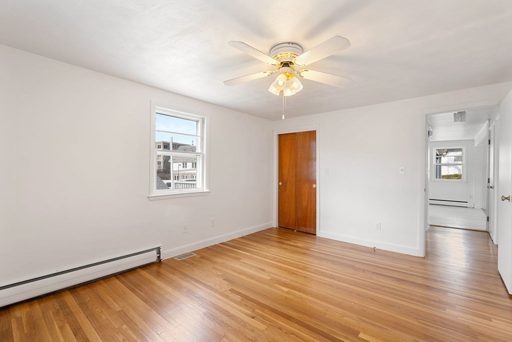 21 Desoto Road Boston, MA 02132 - Photo 22 of 37 a view of an empty room with wooden floor and a window