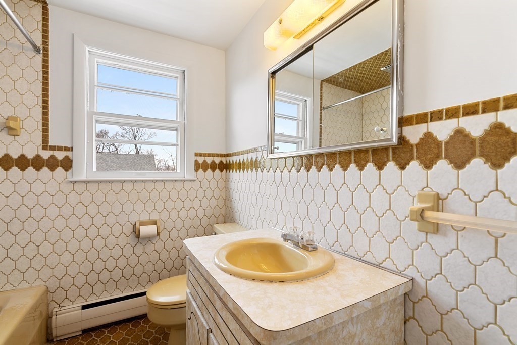 21 Desoto Road Boston, MA 02132 - Photo 23 of 37 a bathroom with a sink toilet and mirror