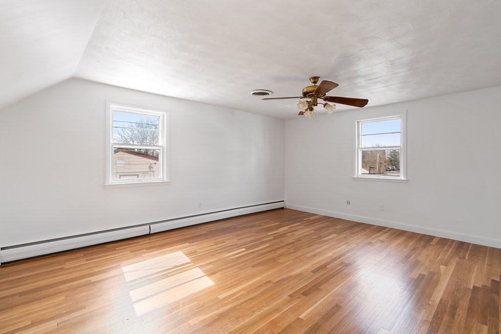 21 Desoto Road Boston, MA 02132 - Photo 26 of 37 wooden floor in an empty room with a window
