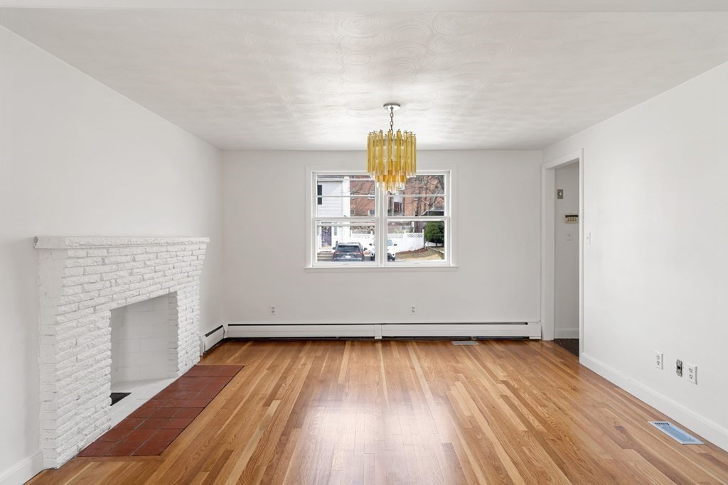 21 Desoto Road Boston, MA 02132 - Photo 8 of 37 a view of empty room with wooden floor and fan