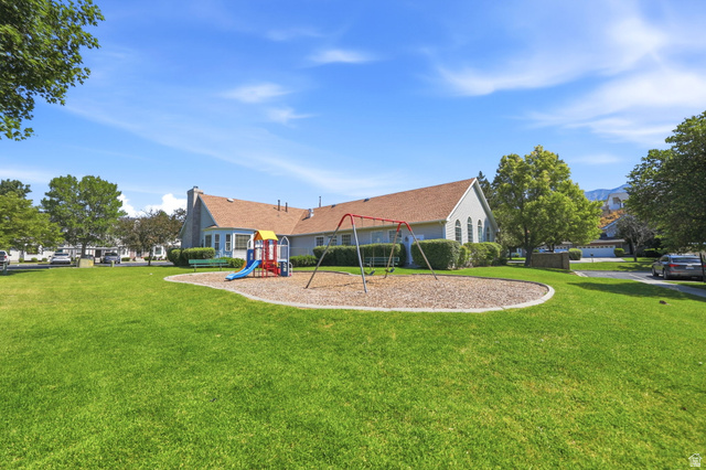 984 Independence Avenue Provo, UT 84604 - Photo 10 of 19 Expansive green space featuring a playground with swings and a slide