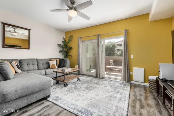 a living room with furniture and a window