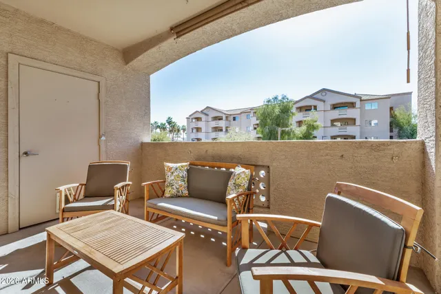 a terrace of a house with outdoor seating