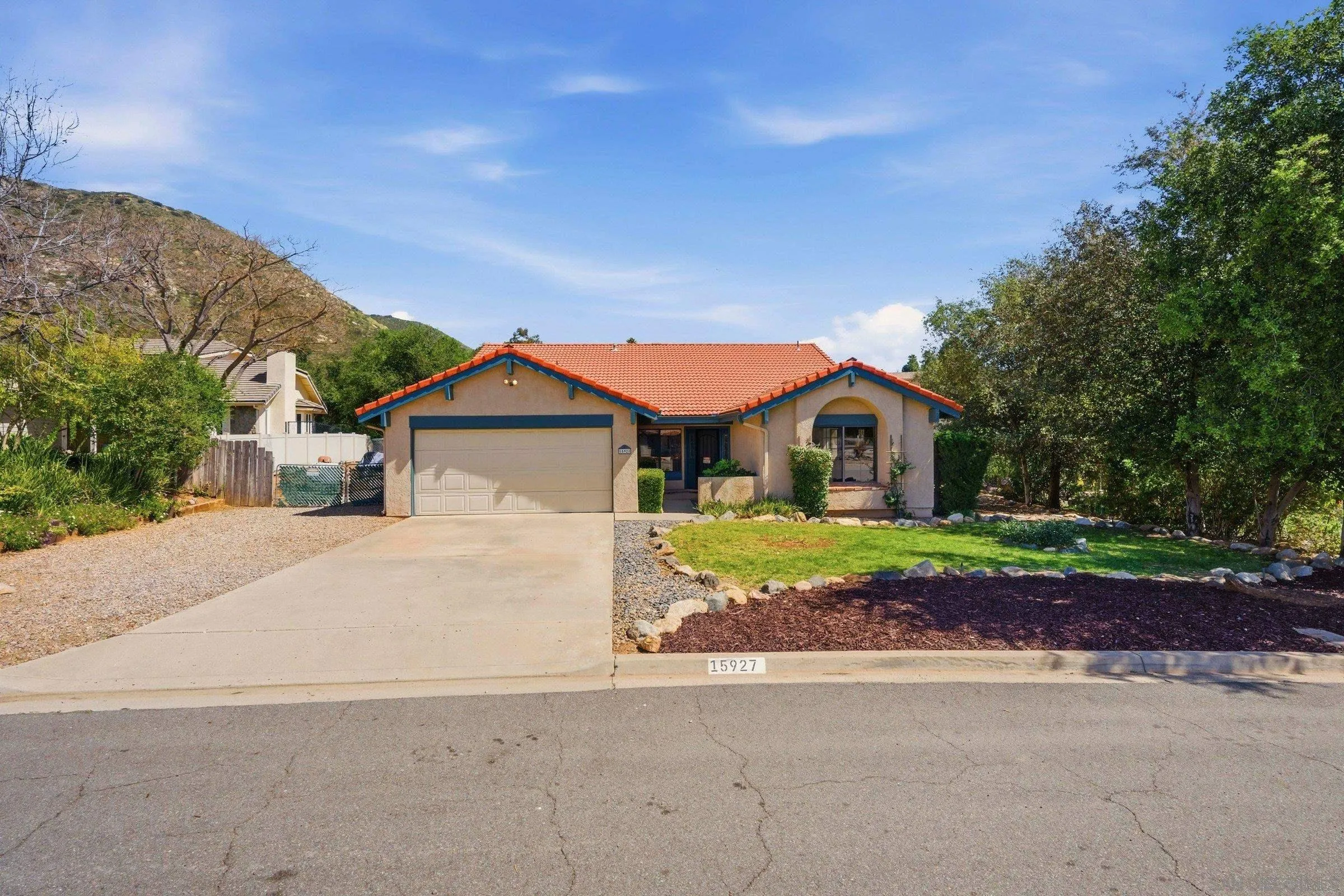 15927 Litten Way Ramona, CA 92065 - Photo 1 of 33 a front view of a house with a yard and garage