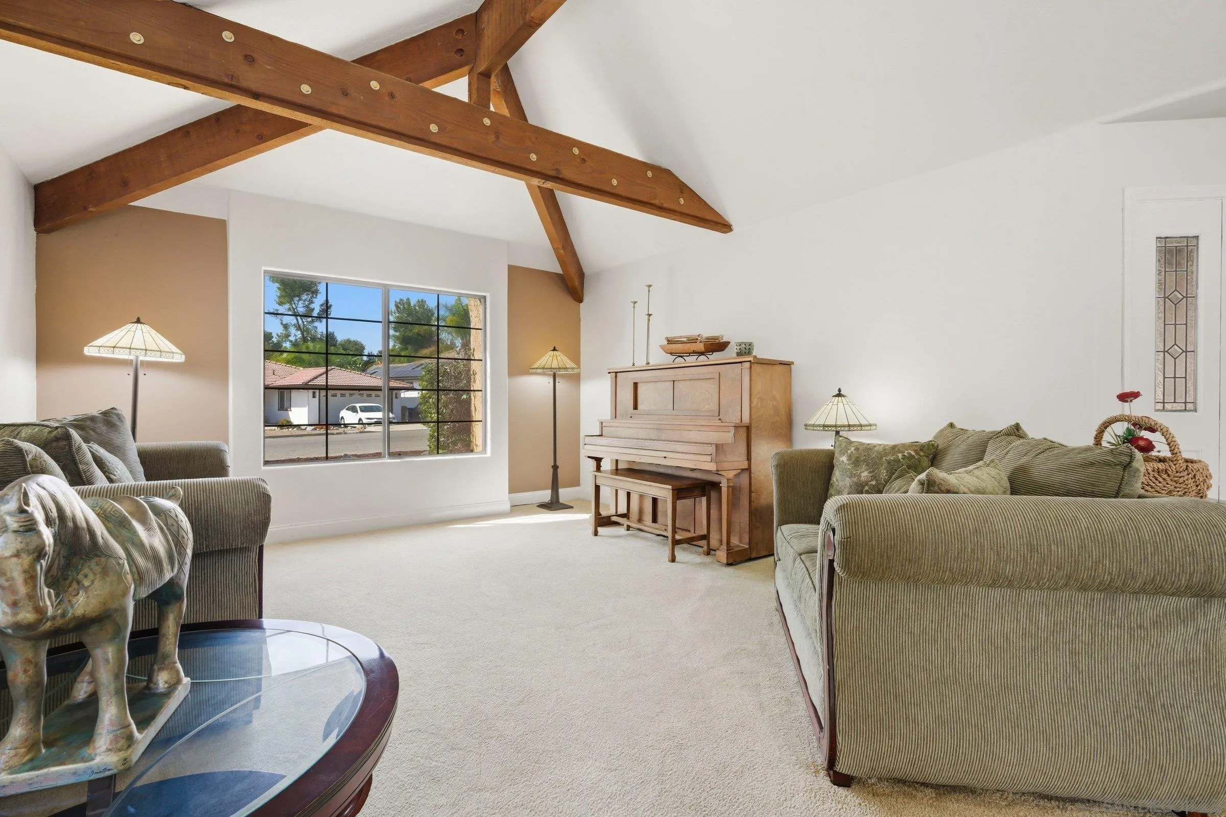 15927 Litten Way Ramona, CA 92065 - Photo 12 of 33 a living room with furniture a fireplace and a table with wooden floor