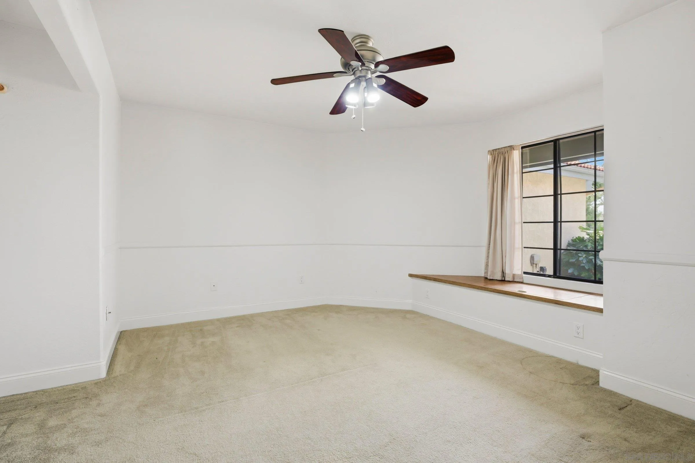 15927 Litten Way Ramona, CA 92065 - Photo 21 of 33 an empty room with windows and fan