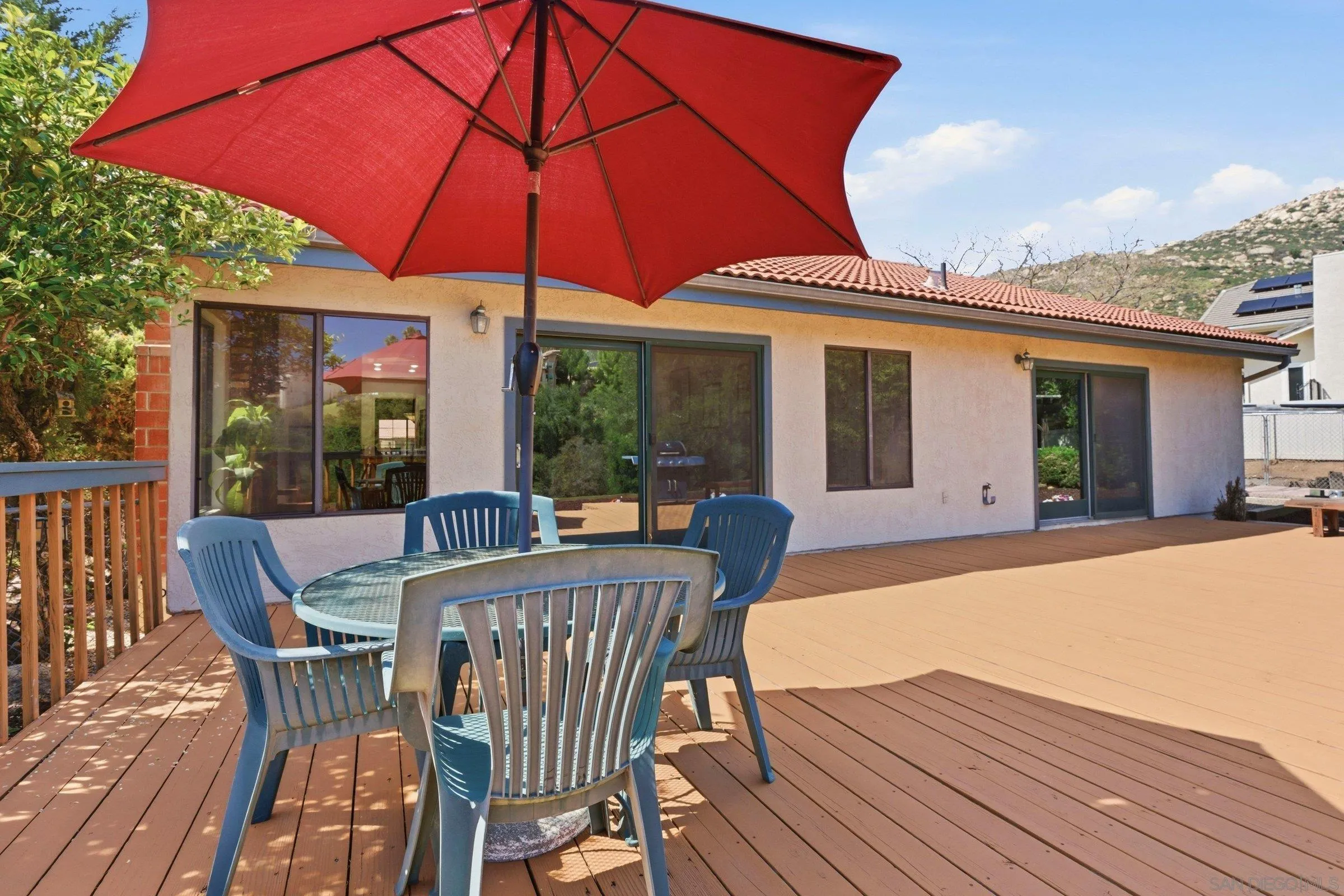 15927 Litten Way Ramona, CA 92065 - Photo 3 of 33 a view of a house with a patio and wooden flooring