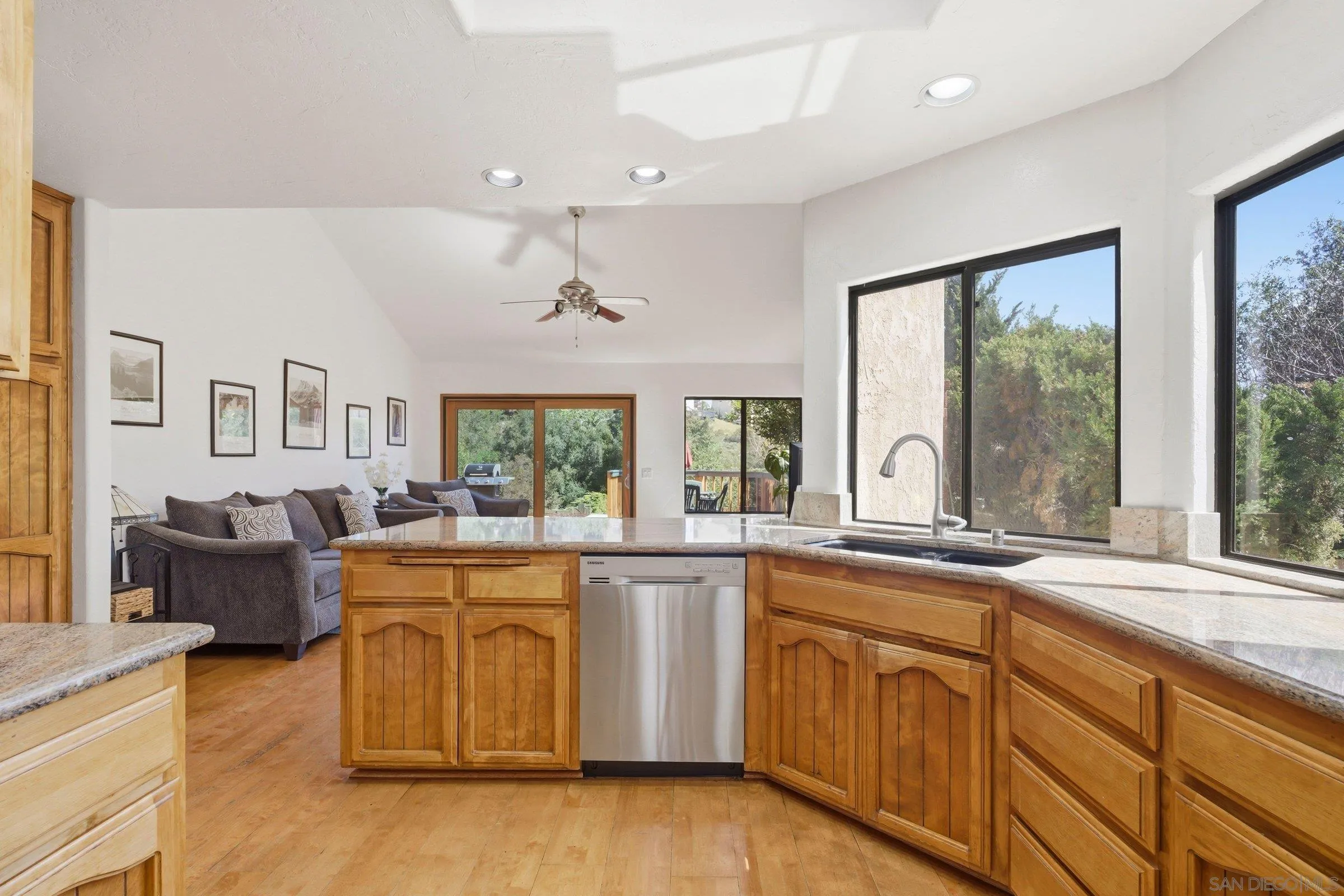 15927 Litten Way Ramona, CA 92065 - Photo 5 of 33 a large white kitchen with cabinets a sink and appliances