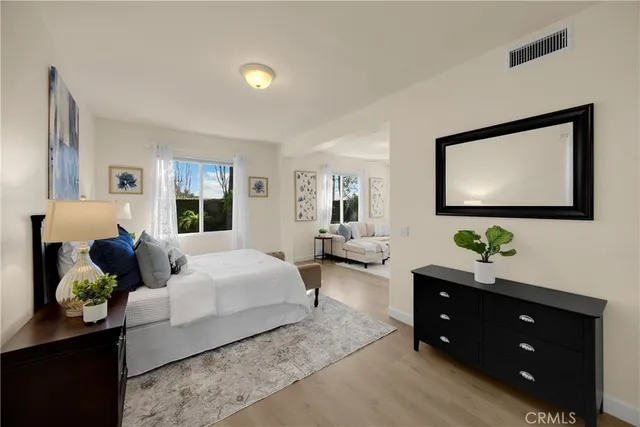 a bed room with bed and a window