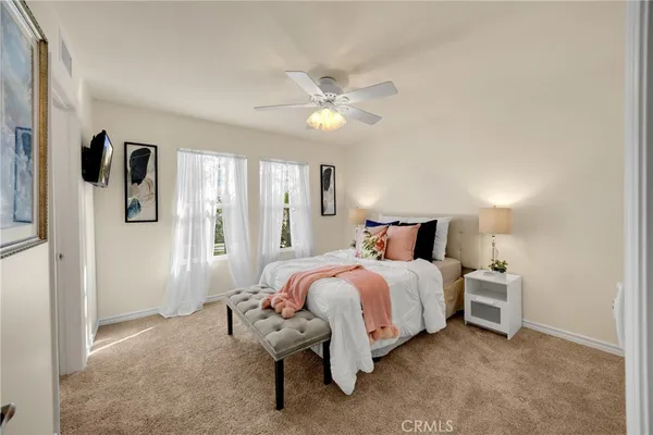 a bed room with a bed and a chandelier