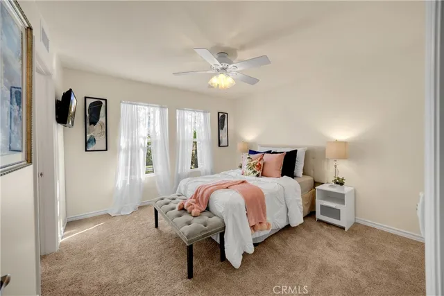 a bed room with a bed and a chandelier