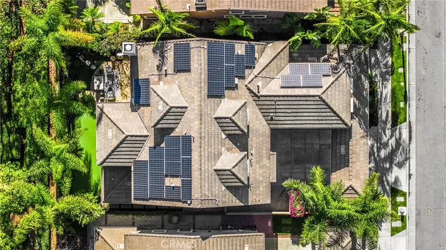 a view of a house with a palm tree
