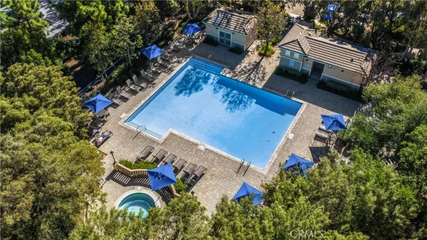 an aerial view of a house with outdoor space