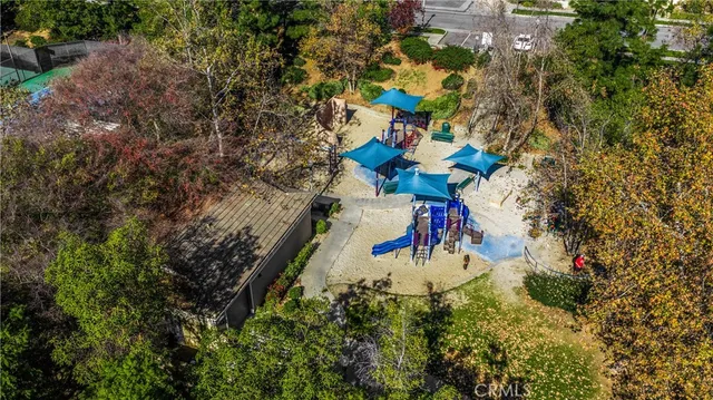 an aerial view of a house with outdoor space
