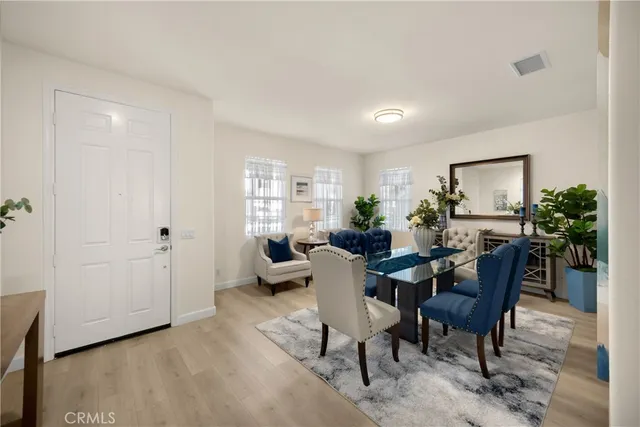 a view of a livingroom with furniture and a window