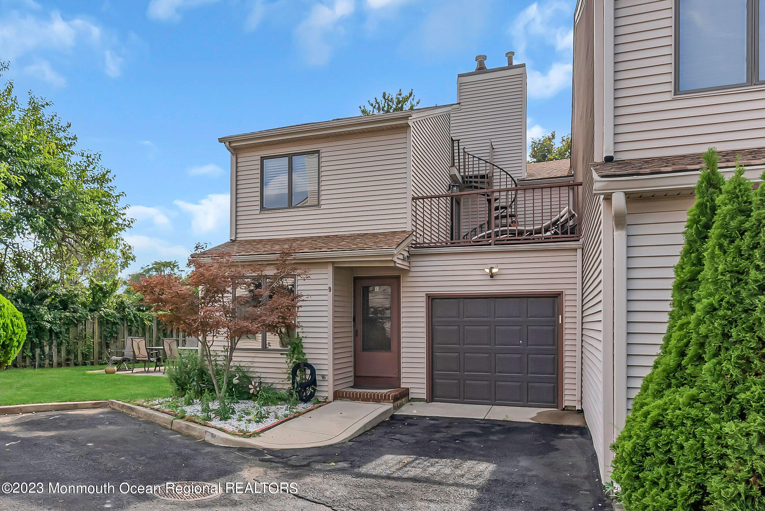 700 Ocean Avenue, Unit 9 Long Branch, NJ 07740 - Photo 1 of 35 a front view of a house with garden
