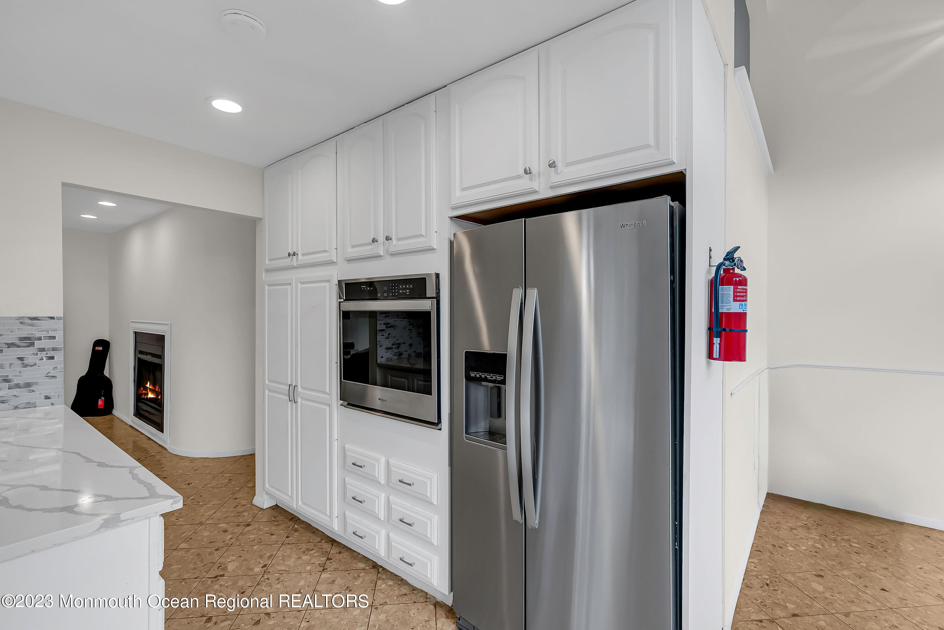 700 Ocean Avenue, Unit 9 Long Branch, NJ 07740 - Photo 12 of 35 a kitchen with stainless steel appliances a refrigerator and a stove top oven