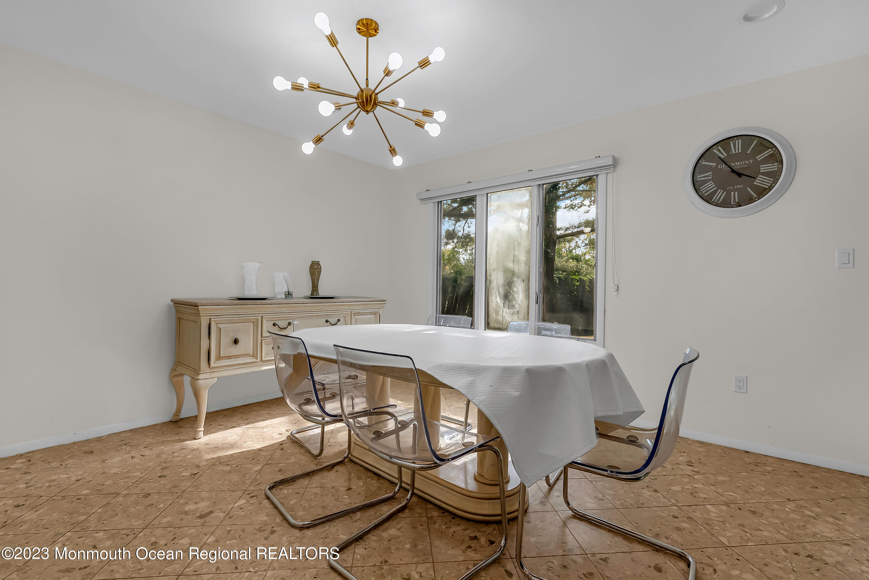 700 Ocean Avenue, Unit 9 Long Branch, NJ 07740 - Photo 13 of 35 a view of a dining room with furniture and a chandelier