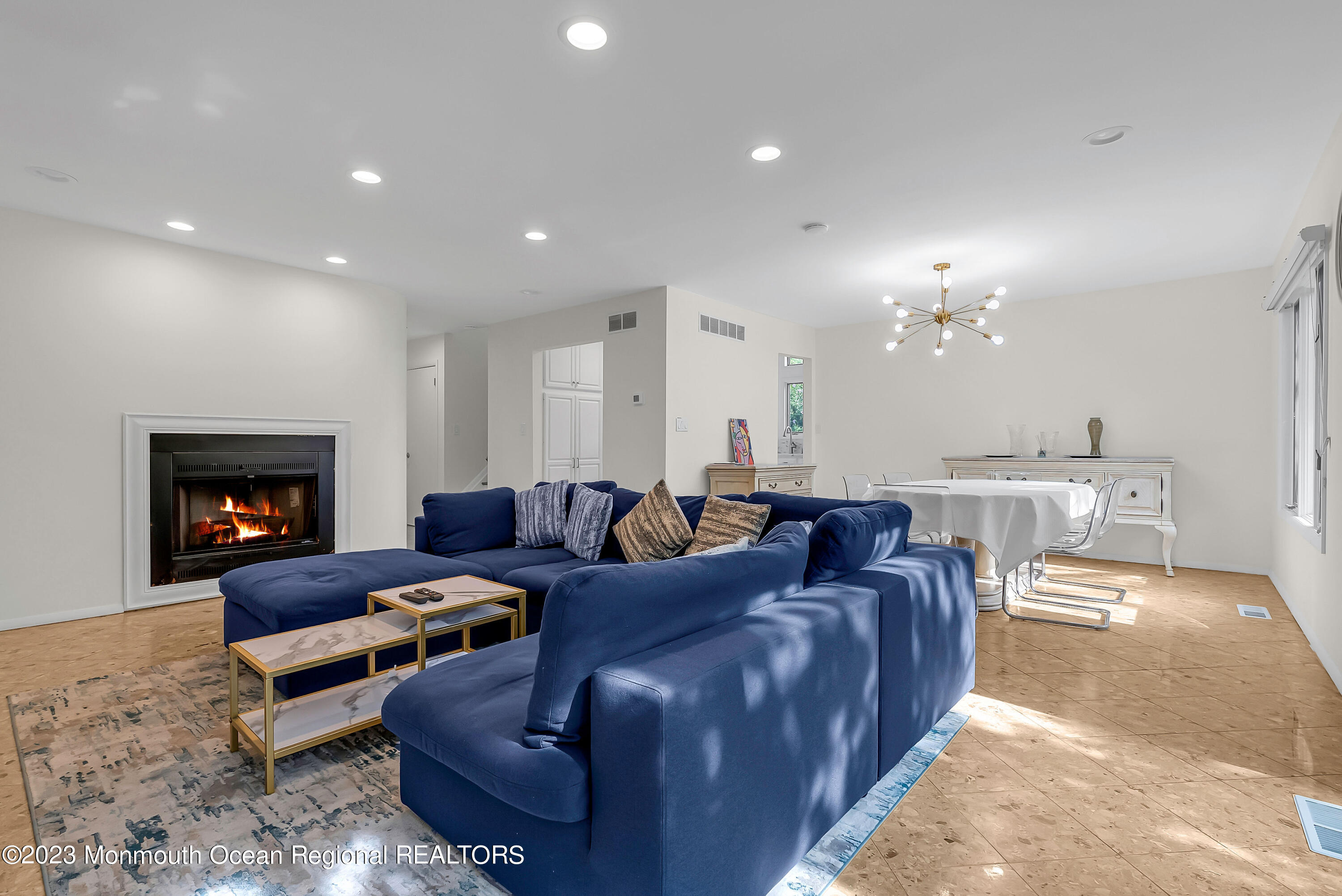 700 Ocean Avenue, Unit 9 Long Branch, NJ 07740 - Photo 15 of 35 a living room with furniture and a fireplace