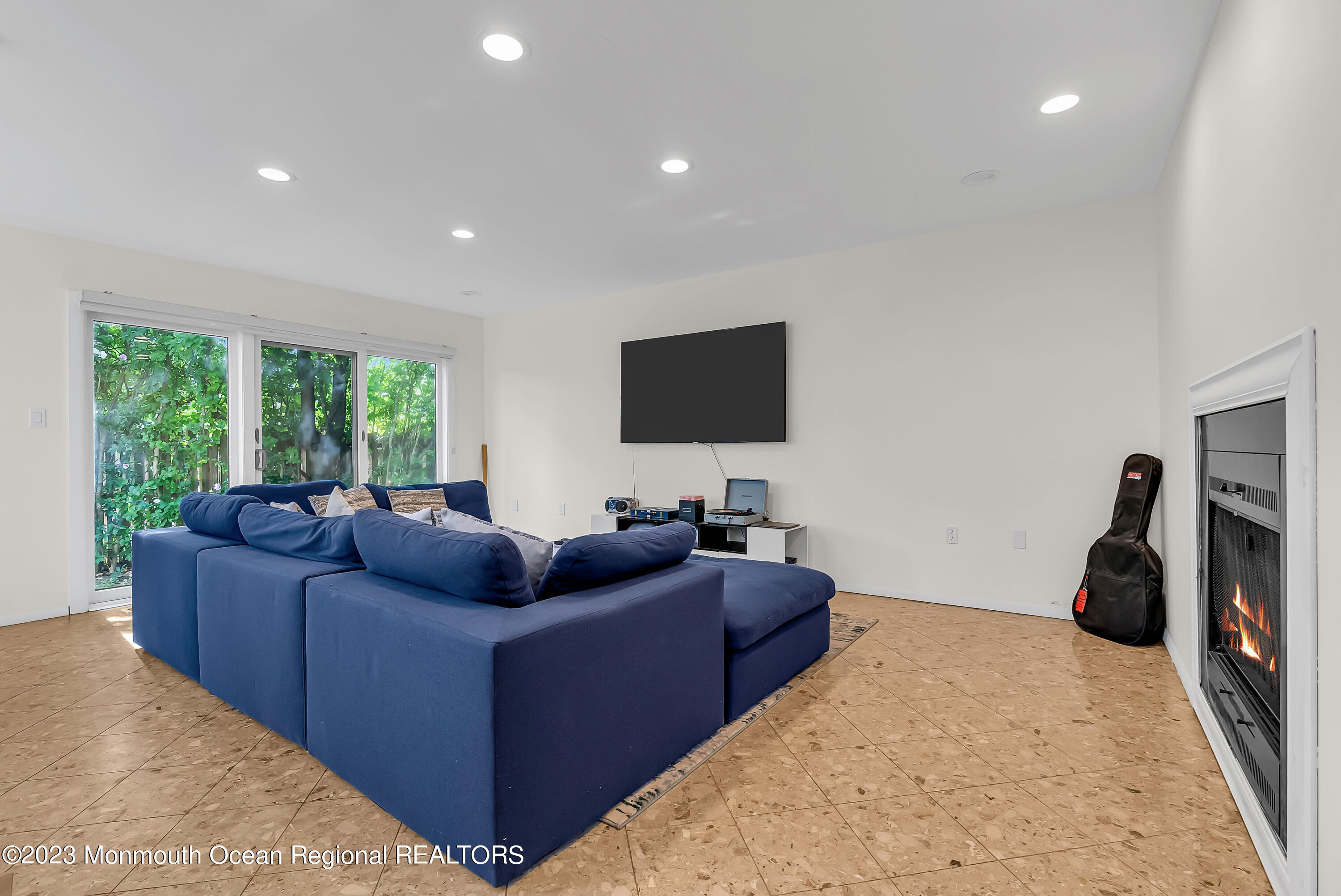 700 Ocean Avenue, Unit 9 Long Branch, NJ 07740 - Photo 16 of 35 a living room with furniture and a flat screen tv