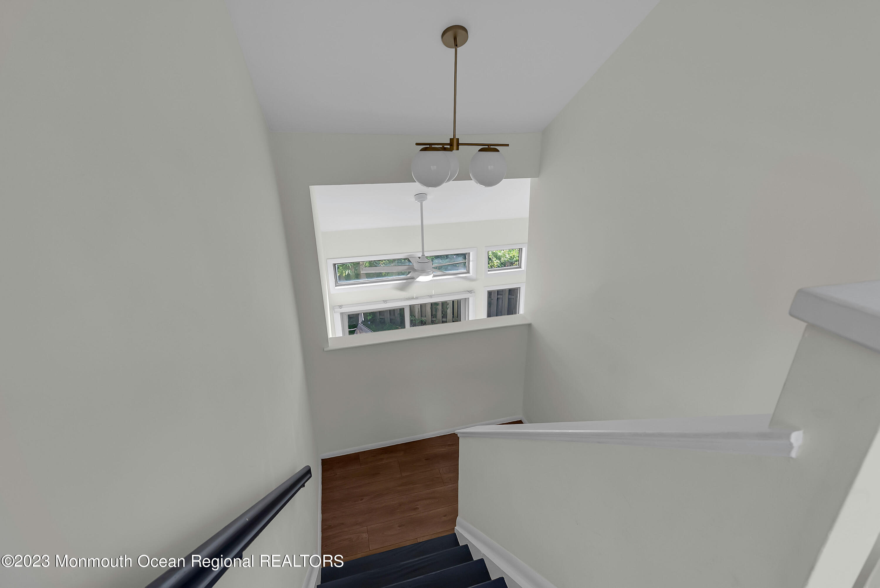 700 Ocean Avenue, Unit 9 Long Branch, NJ 07740 - Photo 19 of 35 a view of a room with a wooden floor and white wall