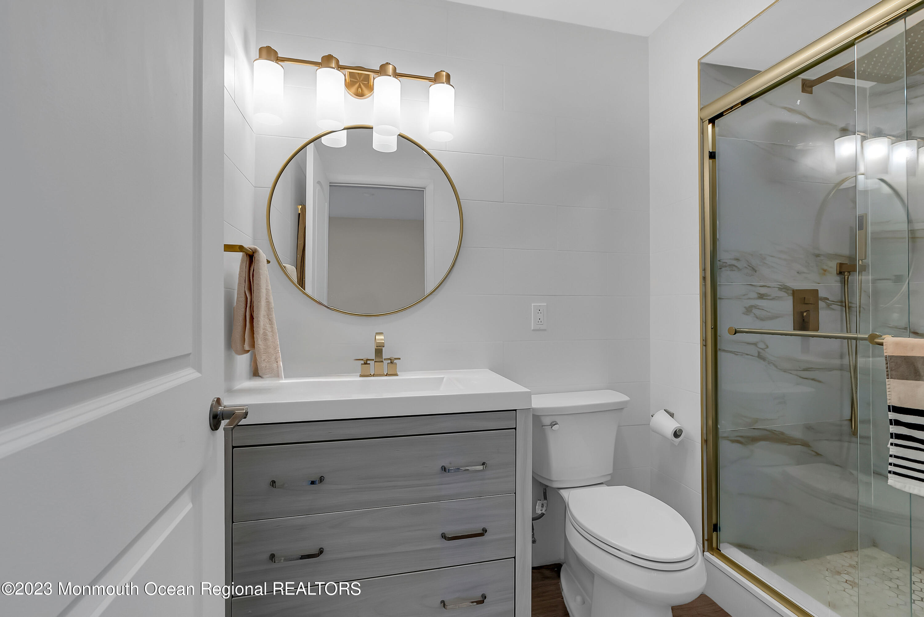 700 Ocean Avenue, Unit 9 Long Branch, NJ 07740 - Photo 21 of 35 a bathroom with a toilet sink and mirror