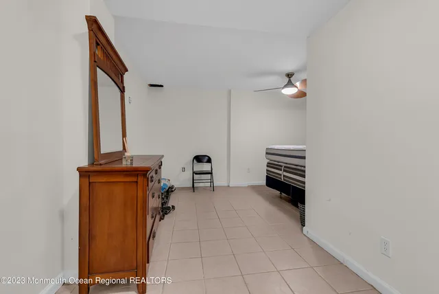 a view of an empty room with windows