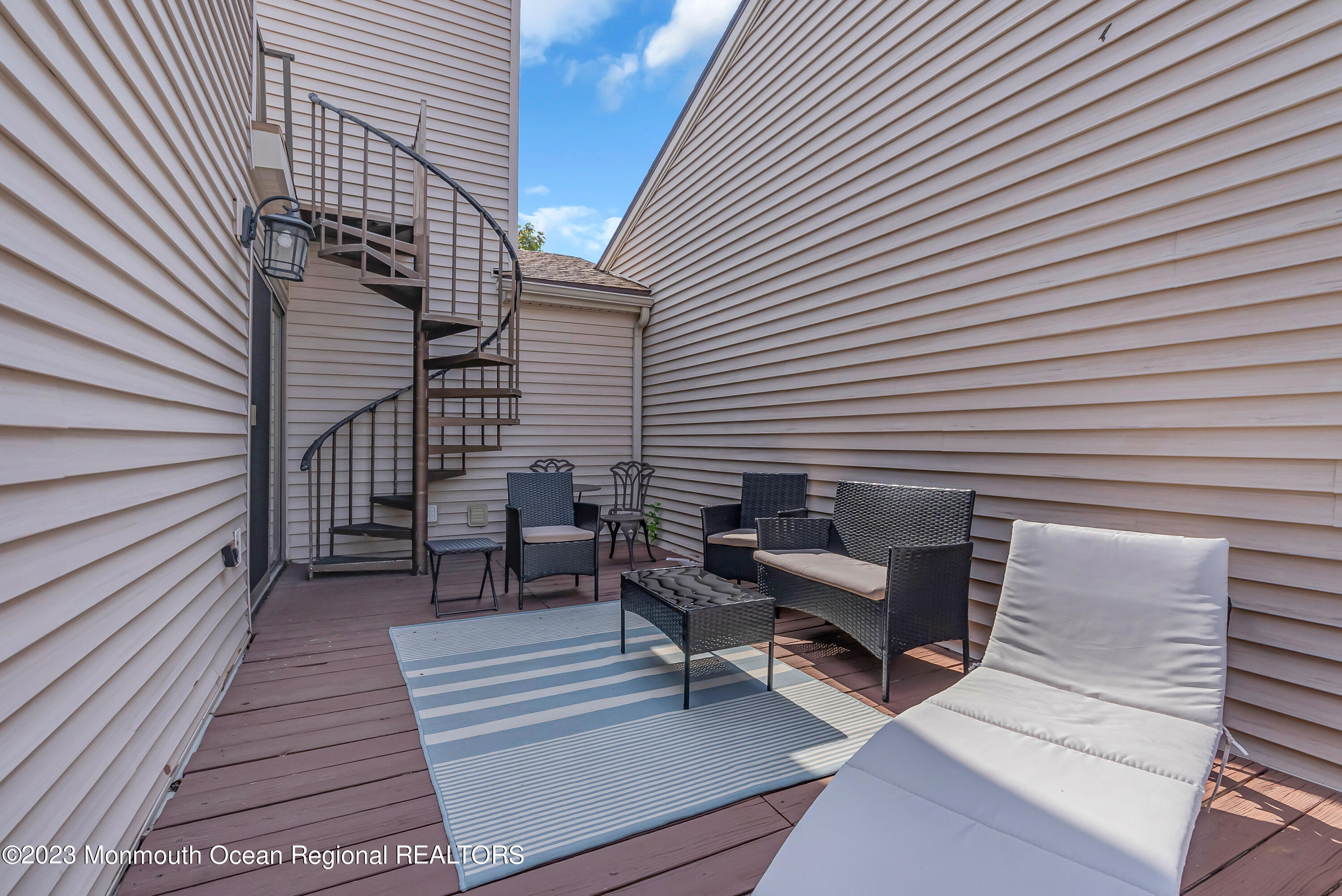 700 Ocean Avenue, Unit 9 Long Branch, NJ 07740 - Photo 30 of 35 a view of a patio with a table and chairs