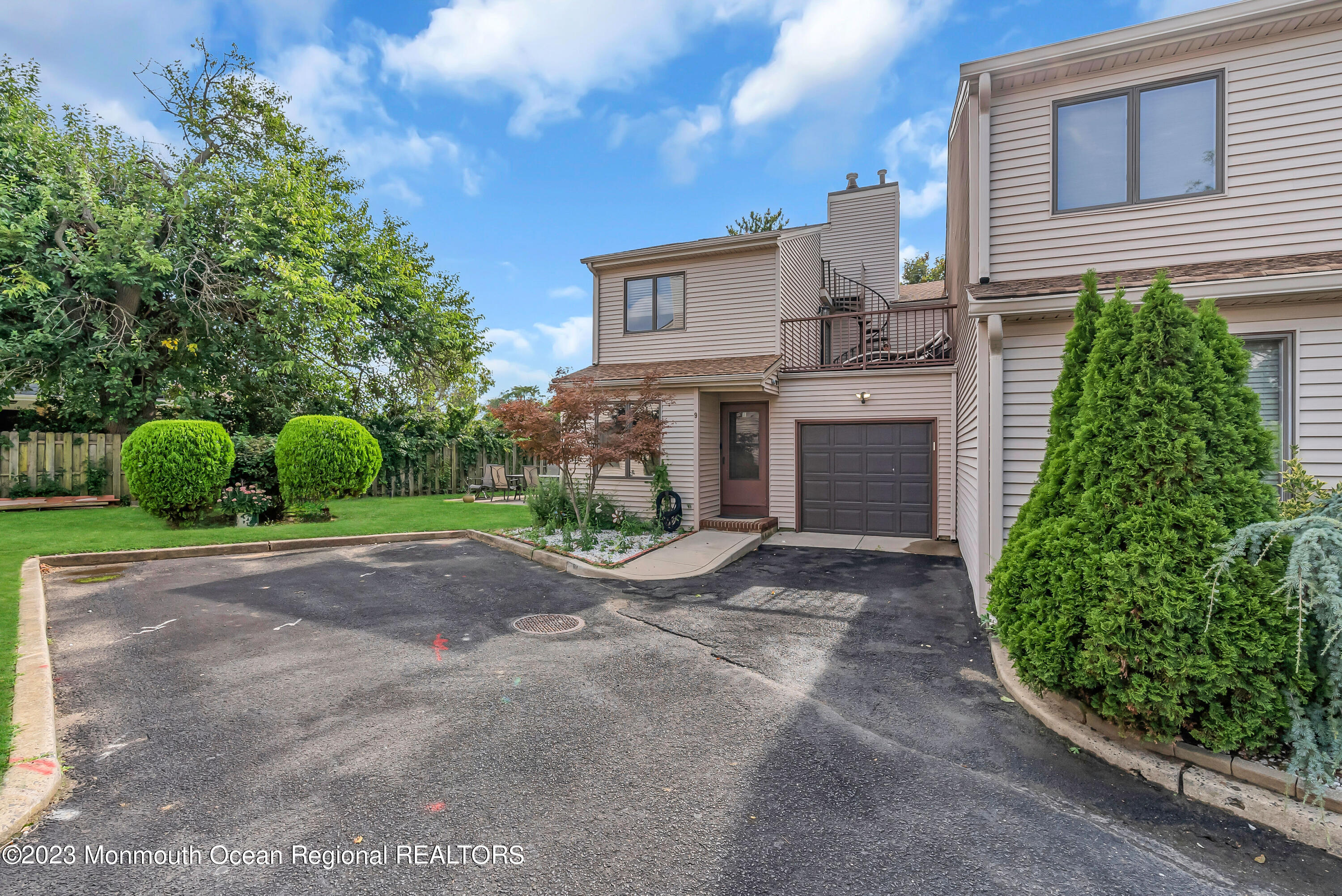700 Ocean Avenue, Unit 9 Long Branch, NJ 07740 - Photo 3 of 35 a front view of a house with garden