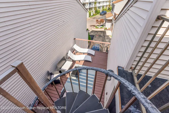 a view of a balcony with chairs