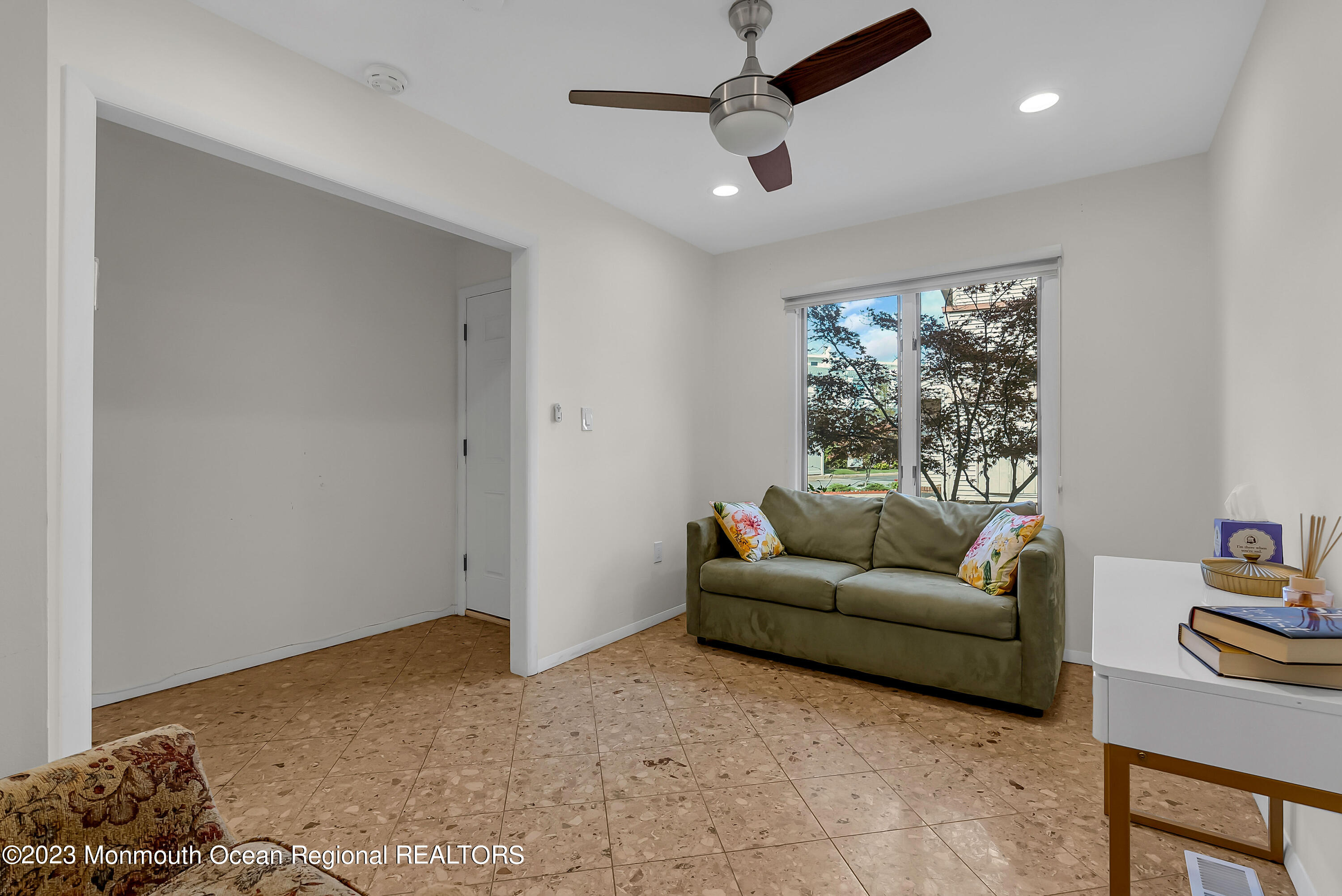 700 Ocean Avenue, Unit 9 Long Branch, NJ 07740 - Photo 5 of 35 a living room with furniture and a window