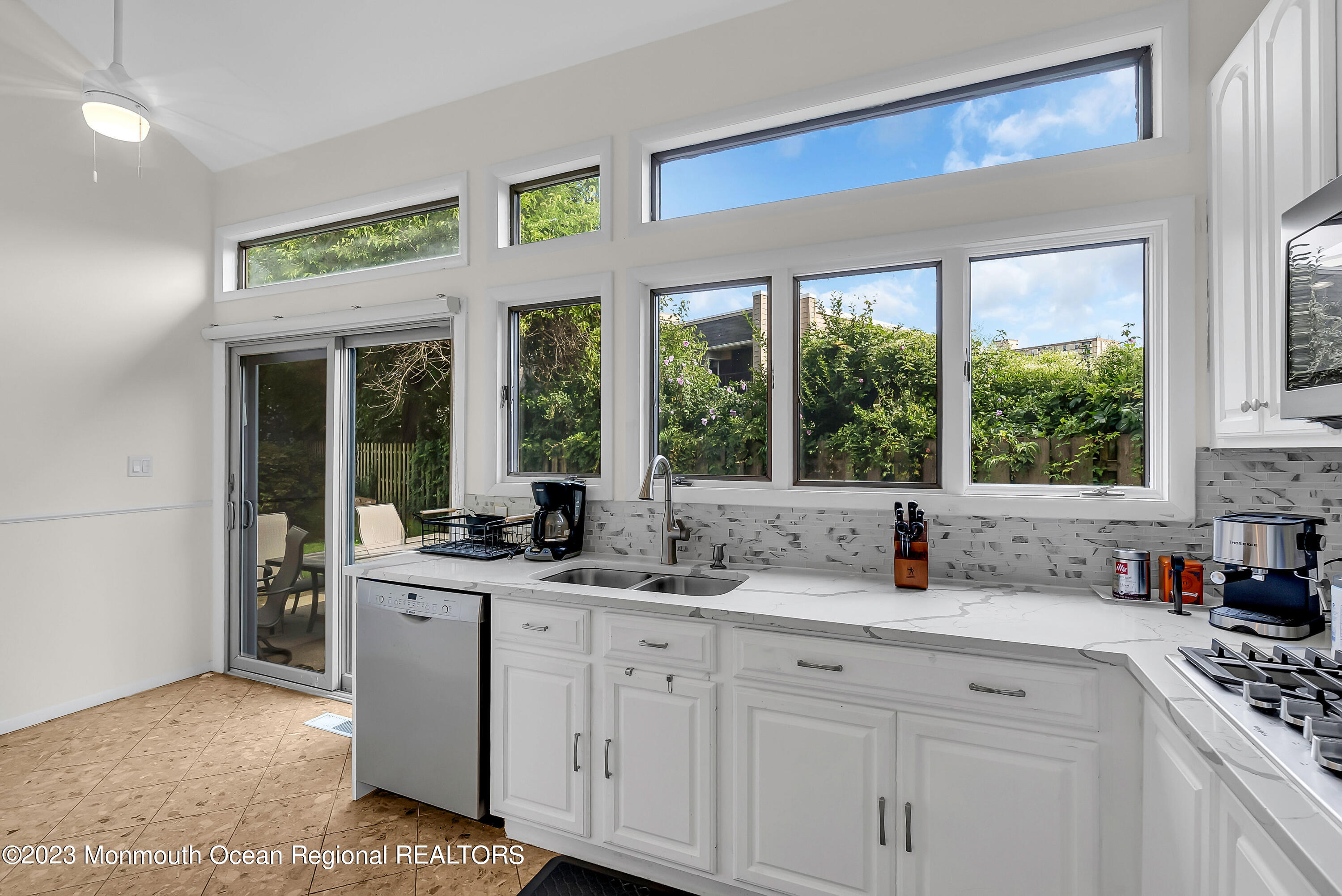 700 Ocean Avenue, Unit 9 Long Branch, NJ 07740 - Photo 10 of 35 a kitchen with sink a window and cabinets
