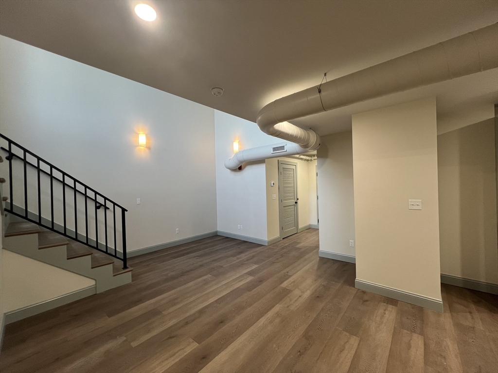 160 Seabury Street, Unit 30 Fall River, MA 02720 - Photo 3 of 13 a view of a hallway with wooden floor