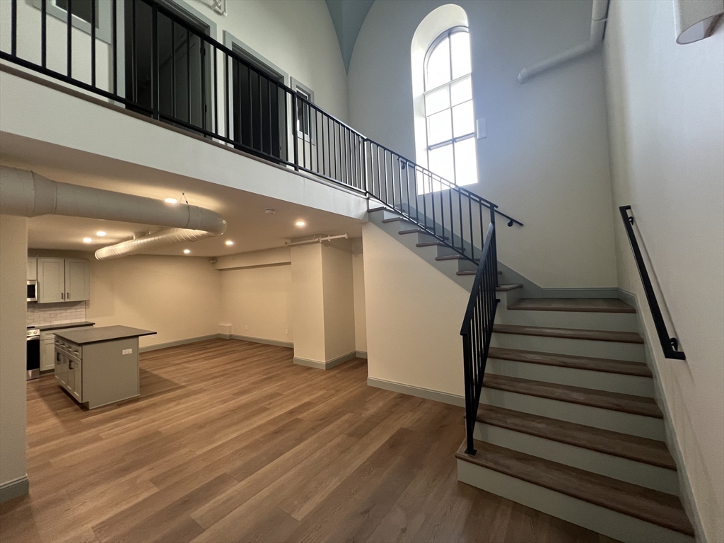 160 Seabury Street, Unit 30 Fall River, MA 02720 - Photo 8 of 16 a view of entryway and hall with wooden floor