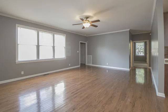 a view of livingroom with hardwood floor and hallway