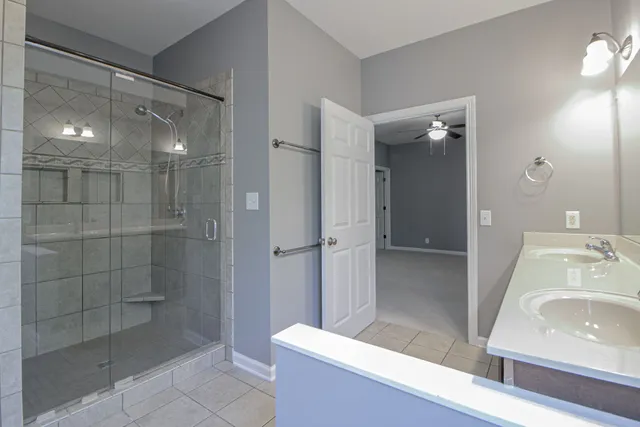 a bathroom with a sink and shower