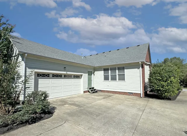 a front view of a house with a garage