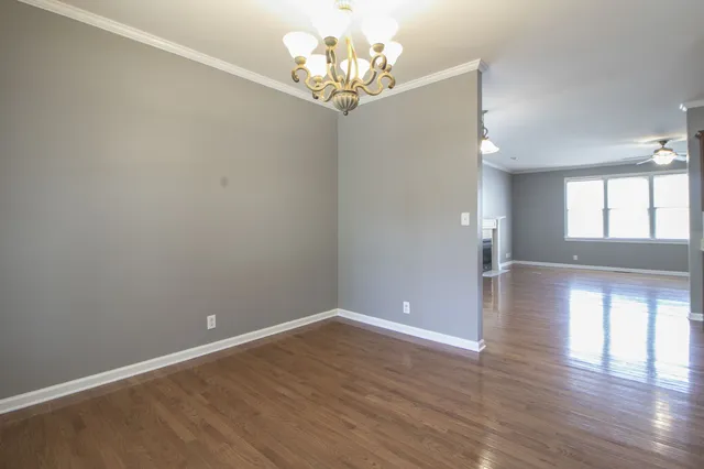 a view of a livingroom with wooden floor