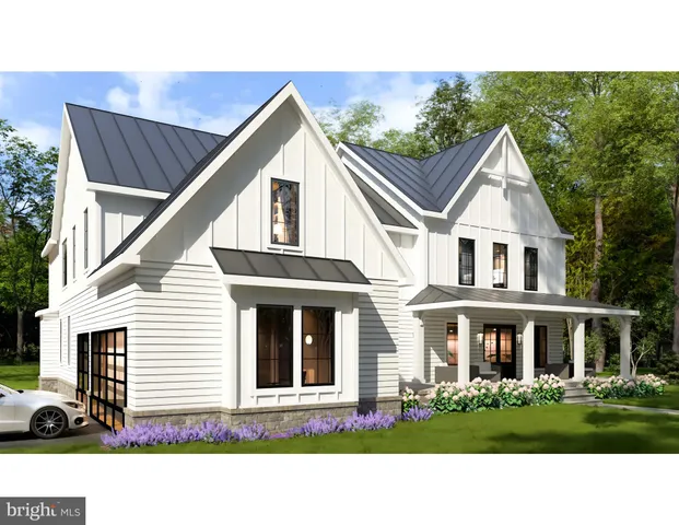 a front view of a residential houses with yard