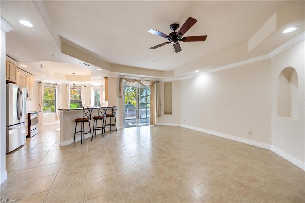 3600 Lansing Loop, Unit 103 Estero, FL 33928 - Photo 12 of 33 a view of a livingroom with furniture and hardwood floor