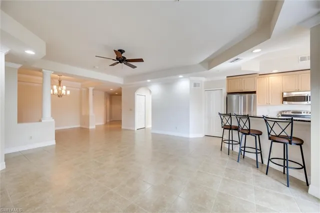 a view of a chandelier in big room and chandelier
