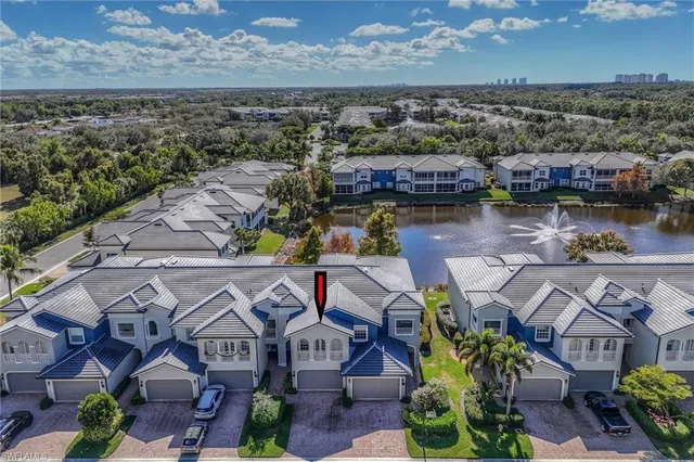 an aerial view of a house with a lake view