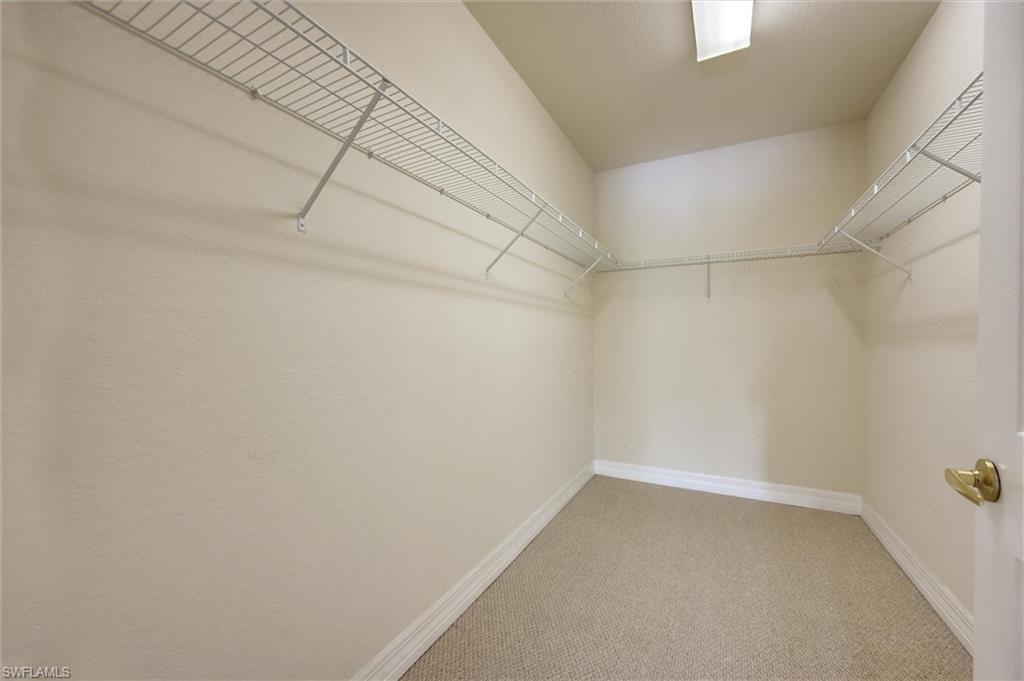 3600 Lansing Loop, Unit 103 Estero, FL 33928 - Photo 24 of 33 a view of a room with racks on the wall