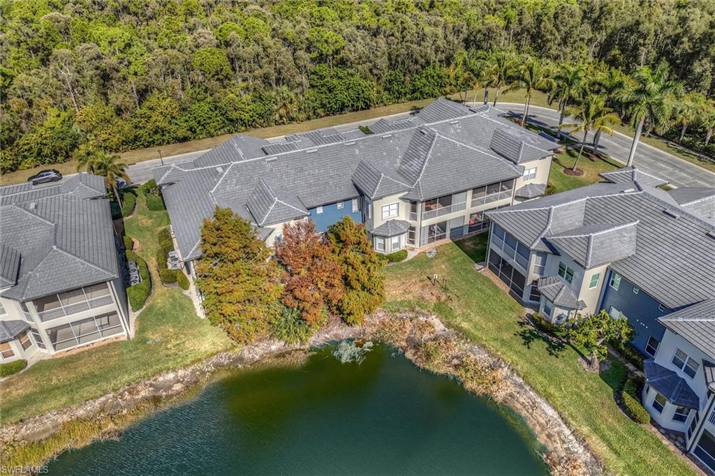 3600 Lansing Loop, Unit 103 Estero, FL 33928 - Photo 8 of 33 an aerial view of residential houses with outdoor space and swimming pool