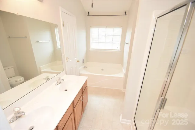 a bathroom with a sink a bathtub and a shower