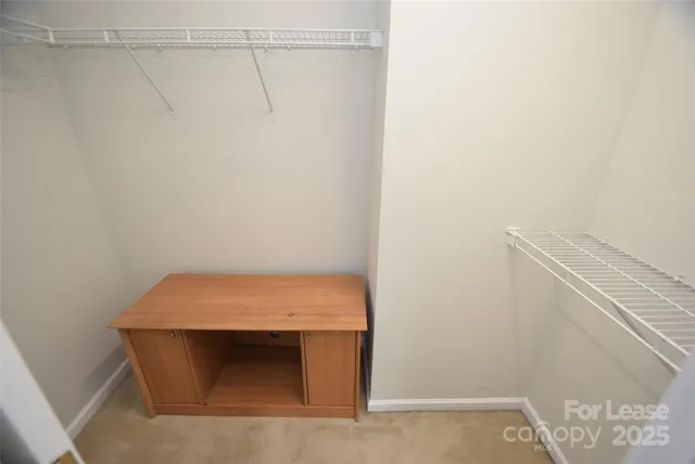 a room with a fireplace and a shelf