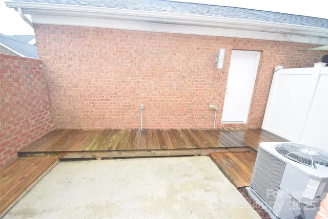 a view of a brick house with many windows