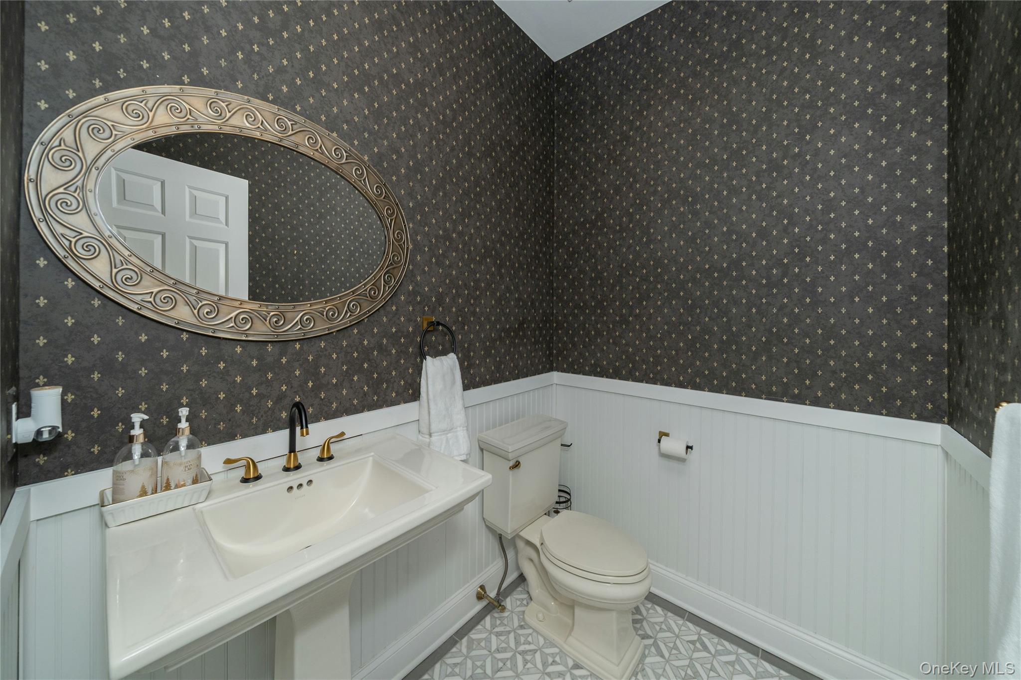 630 Chappaqua Road Briarcliff Manor, NY 10510 - Photo 19 of 41 Stylish main-level powder room with designer wallpaper, elegant finishes, and a warm boutique-inspired feel